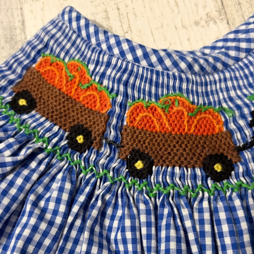 Banana Split Pumpkin Farm Gingham Kids Smocked Dress with Tractor Design - Picture 5 of 9